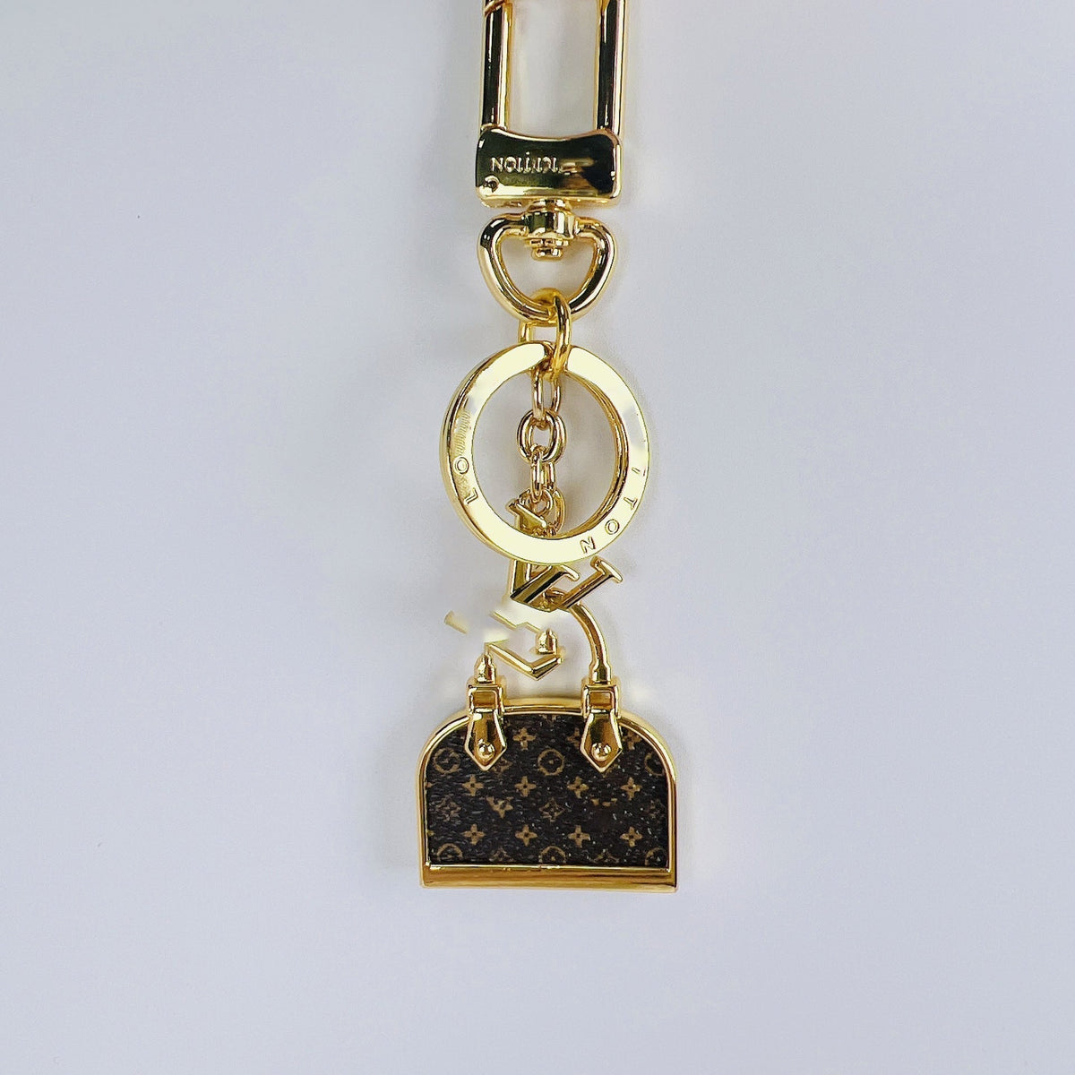 Designer-Mini-Taschenanhänger mit Metallcharms – Originalansicht 2