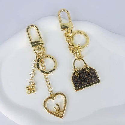 Designer-Mini-Taschenanhänger mit Metallcharms – Originalansicht 7