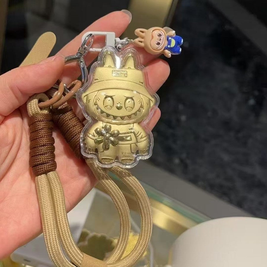 Goldfarbener Mini-Figurenanhänger – Originalansicht 1